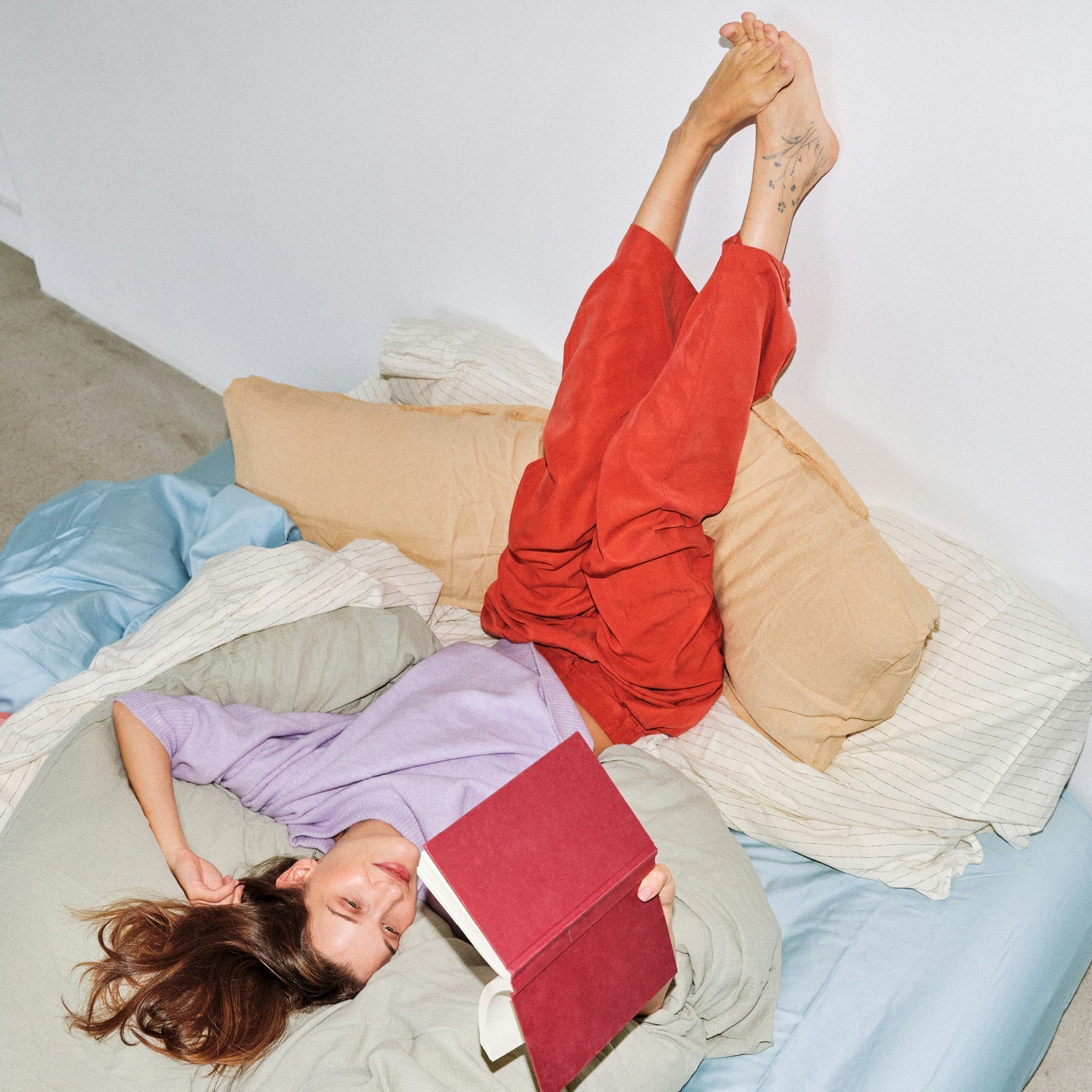 Woman Chilling Reading Book in Bed